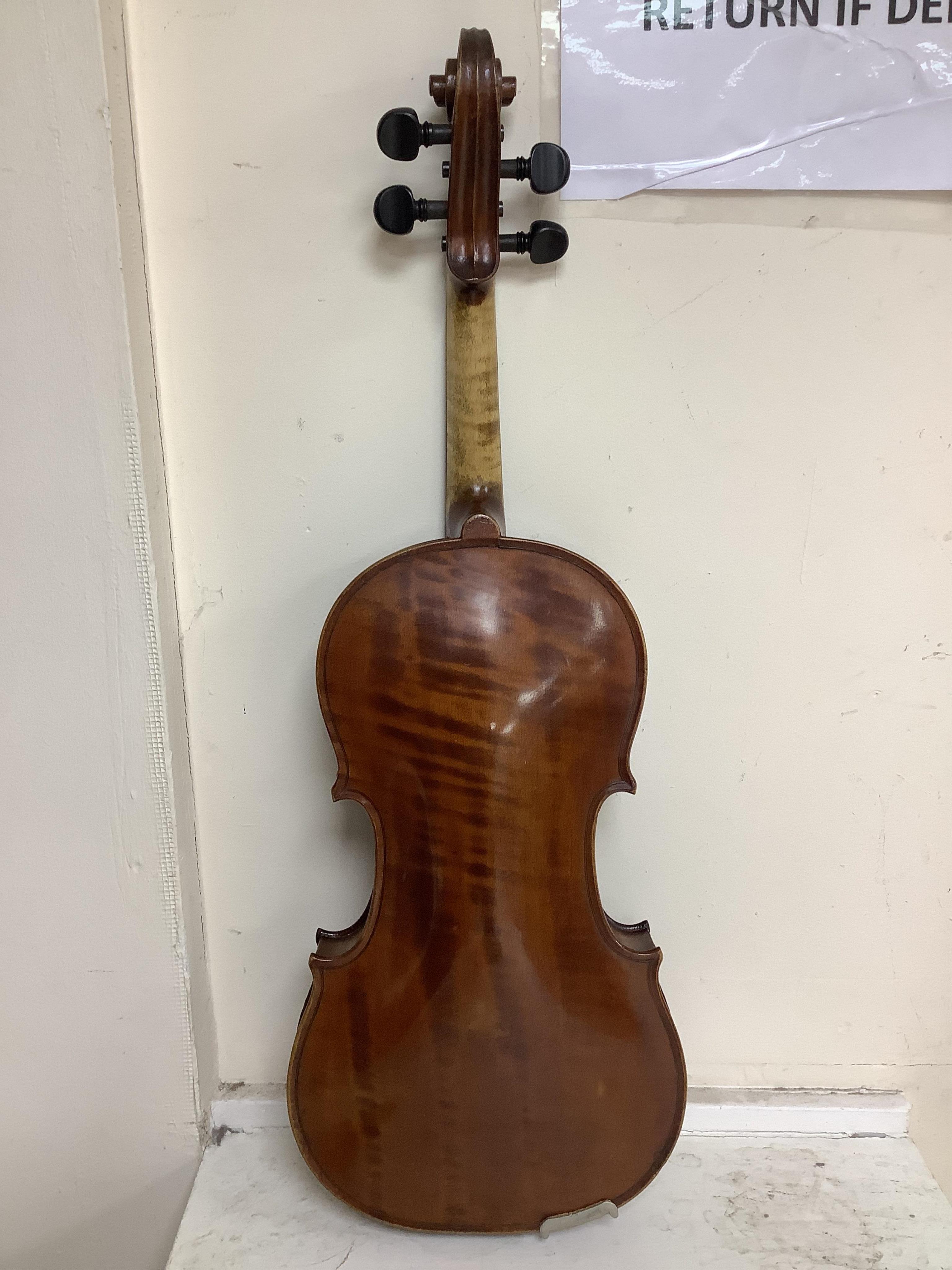 A cased late 19th century violin, signed ‘Nicolas Bertolini’, back 36.3cm, with bow stamped Paesold, CITES Submission reference, D9GSYMLJ